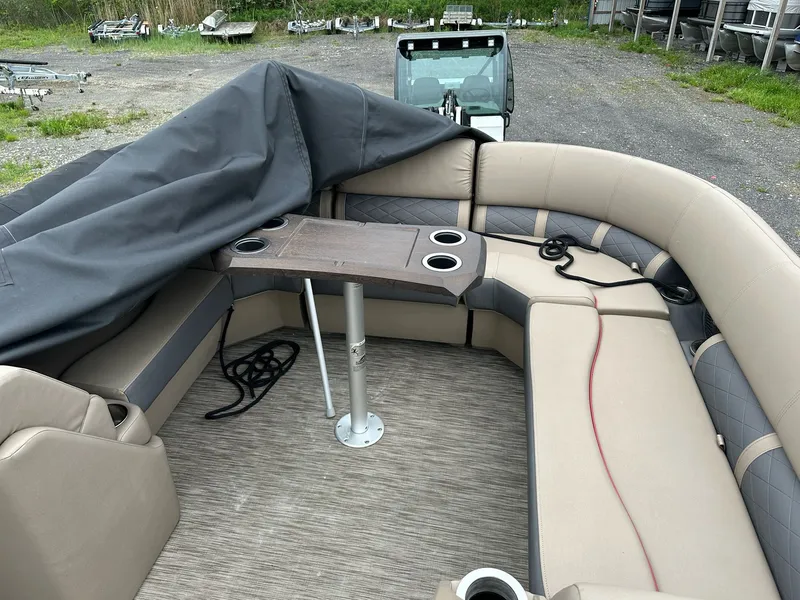 Slide: The Image of Interior of a 2022 Bennington 23 LSR pontoon boat with seating area. - 15
