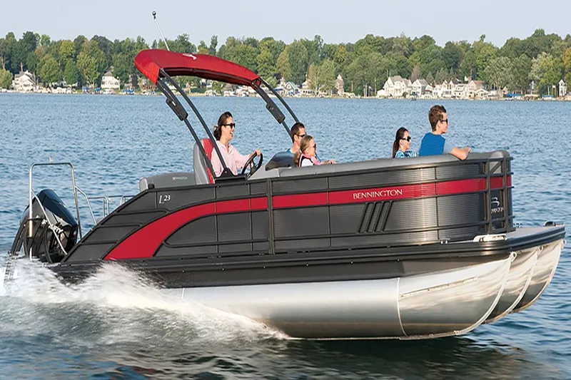 Slide: The Image of Bennington 23 LSR 2022 pontoon boat on a lake with passengers. - 21