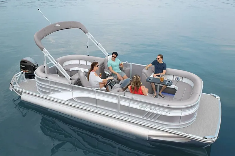 Slide: The Image of Bennington 23 LSR 2022 pontoon boat with people on calm water. - 23
