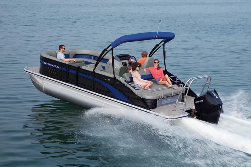 Slide: The Image of Bennington 23 LSR 2022 pontoon boat on water with passengers. - 29