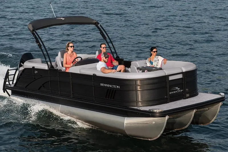 Slide: The Image of Bennington 23 LSR 2022 pontoon boat on water with passengers. - 30