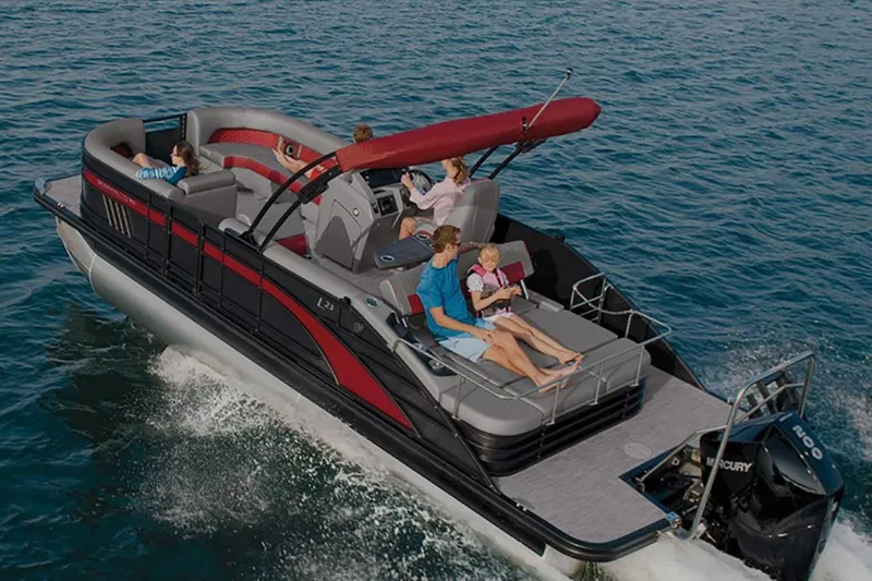 Slide: The Image of Bennington 23 LSR 2022 pontoon boat on water with passengers. - 32