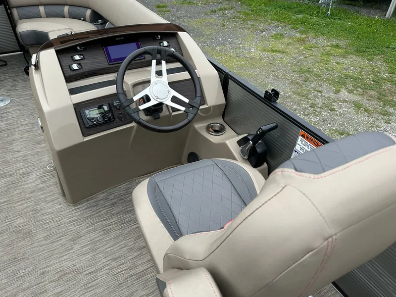 Slide: The Image of Interior of 2022 Bennington 23 LSR with steering console and seat. - 7