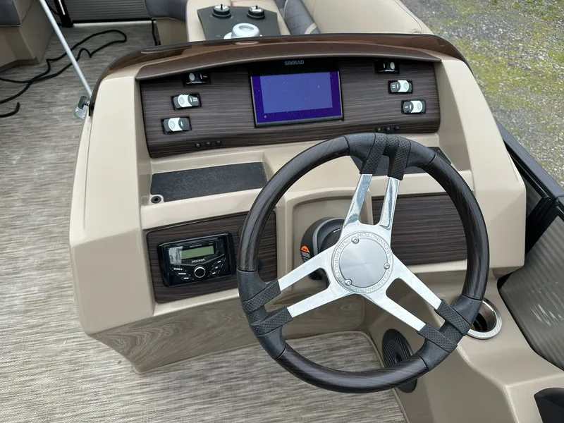 Slide: The Image of 2022 Bennington 23 LSR steering console with modern design. - 8