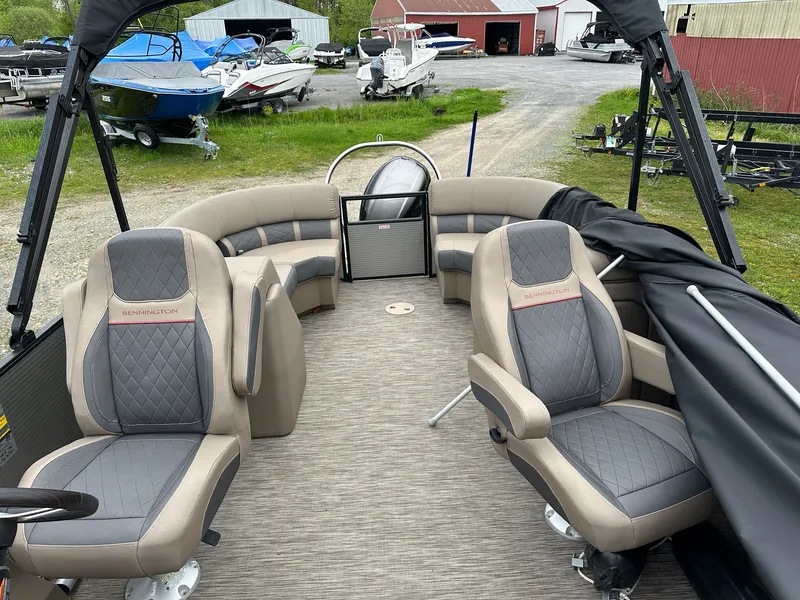 Slide: The Image of Interior of a 2022 Bennington 23 LSR pontoon boat with luxurious seating. - 9