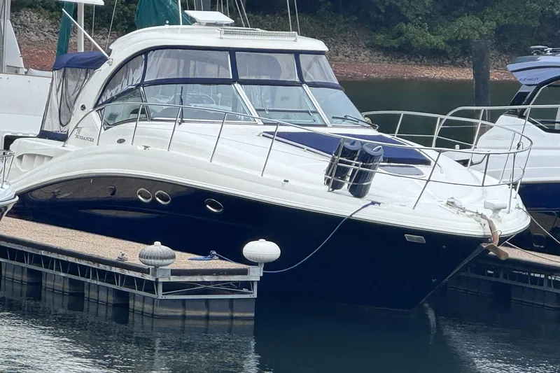 The Image of 2004 Sea Ray 390 Sundancer yacht docked at a marina, featuring sleek design and modern amenities. - 0