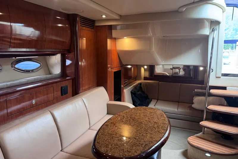 Slide: The Image of Luxurious interior of a 2004 Sea Ray 390 Sundancer yacht with elegant wood finishes. - 19