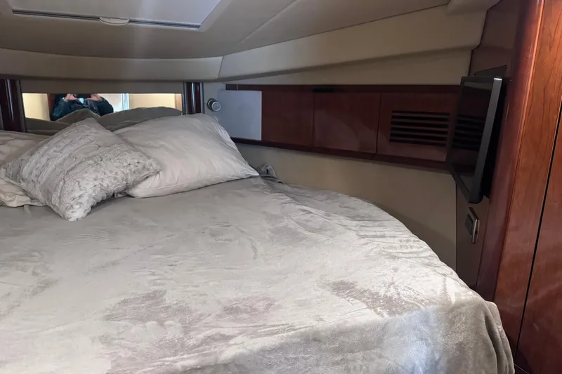 Slide: The Image of Luxurious cabin interior of 2004 Sea Ray 390 Sundancer with cozy bedding. - 21