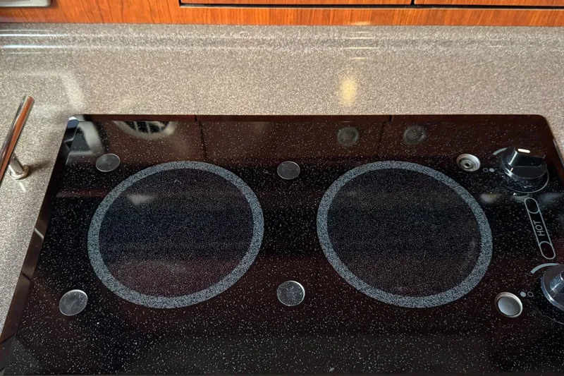 Slide: The Image of Stovetop on 2004 Sea Ray 390 Sundancer yacht kitchen counter. - 27