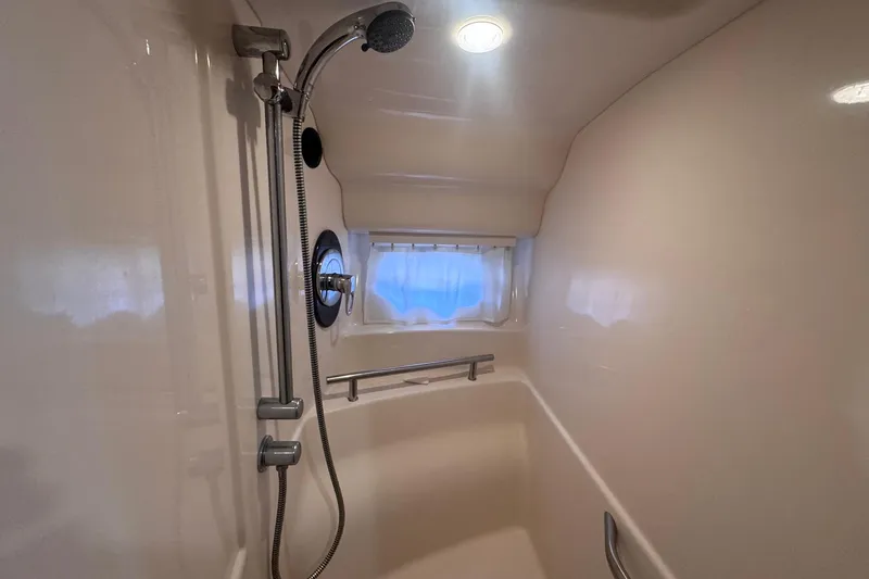 Slide: The Image of Shower area in 2004 Sea Ray 390 Sundancer yacht with handheld showerhead. - 32