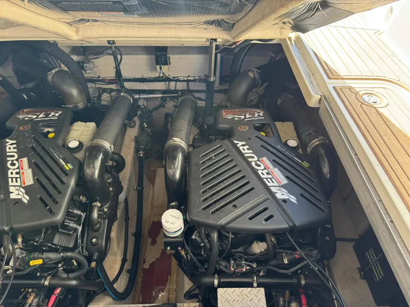 Slide: The Image of Engine compartment of a 2004 Sea Ray 390 Sundancer with twin Mercury engines. - 34