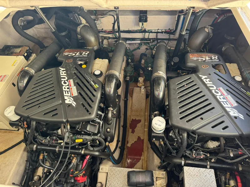 Slide: The Image of Twin Mercury engines in a 2004 Sea Ray 390 Sundancer boat engine room. - 35