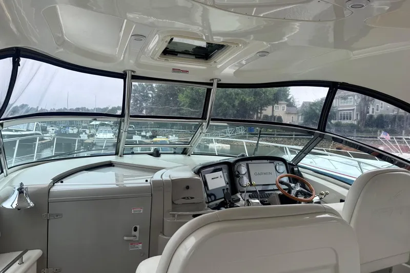 Slide: The Image of Interior view of 2004 Sea Ray 390 Sundancer yacht cockpit with Garmin navigation system. - 4