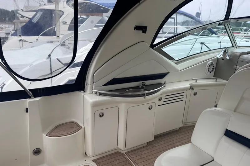 Slide: The Image of 2004 Sea Ray 390 Sundancer yacht interior with sleek cabinetry and seating. - 5