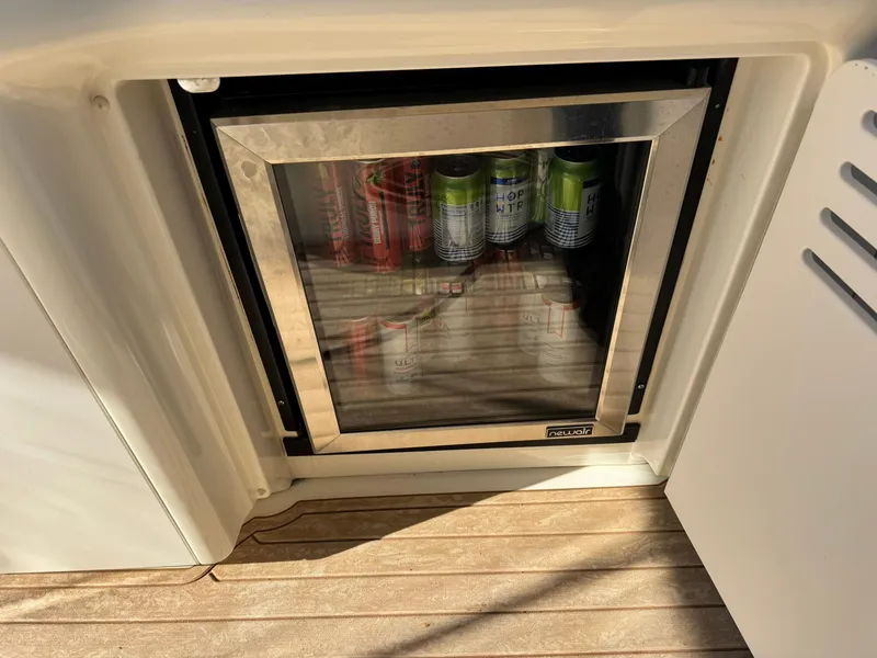 Slide: The Image of Mini fridge stocked with beverages on a 2004 Sea Ray 390 Sundancer yacht. - 7