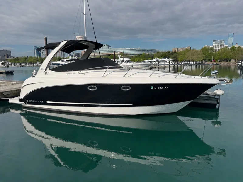 The Image of 2008 Chaparral 310 Signature boat docked in harbor. - 0