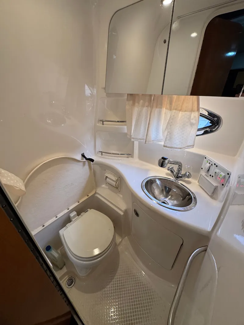 Slide: The Image of Interior of a 2008 Chaparral 310 Signature yacht bathroom. - 11