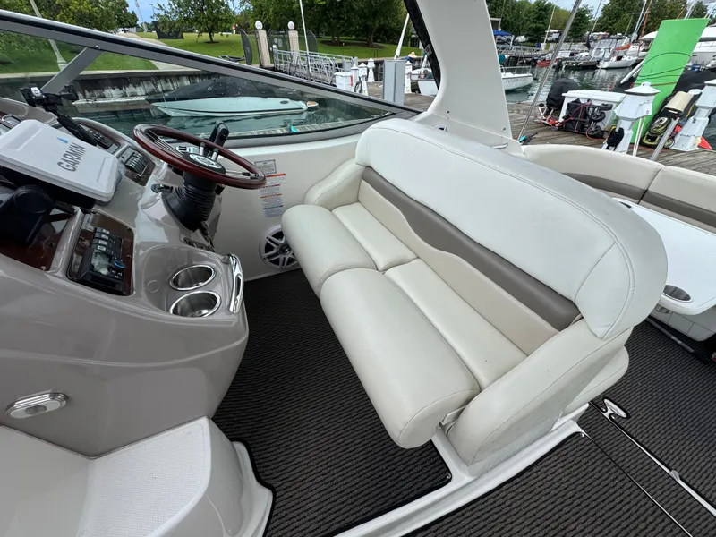 Slide: The Image of Interior of a 2008 Chaparral 310 Signature boat with helm station. - 4