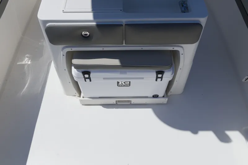 Slide: The Image of 2026 Key West 249 FS boat interior with storage compartment and cooler. - 10