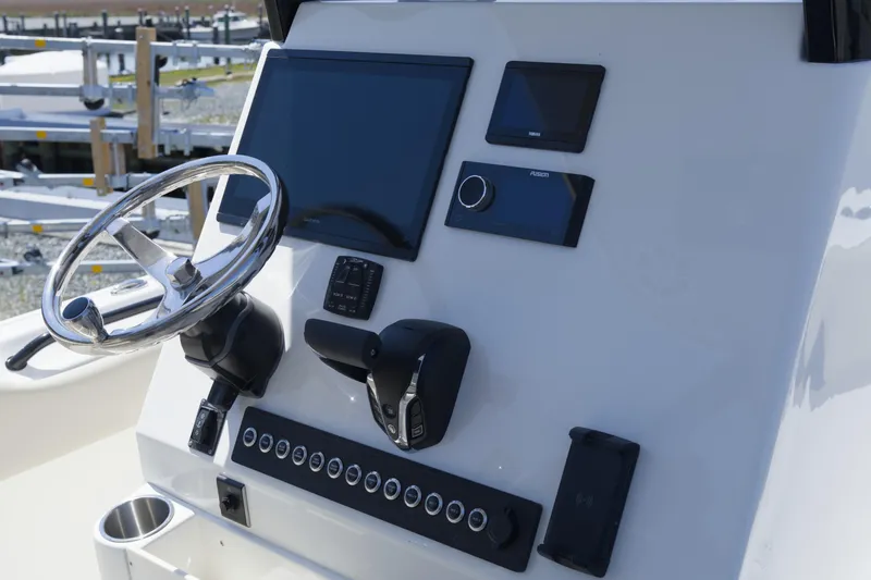 Slide: The Image of Steering console of 2026 Key West 249 FS boat with modern controls and displays. - 12