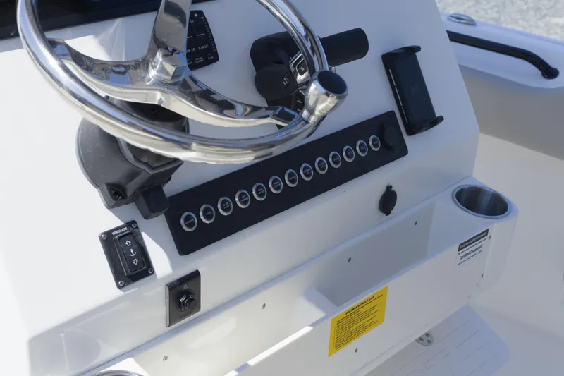 Slide: The Image of 2026 Key West 249 FS boat dashboard with steering wheel and control panel. - 15