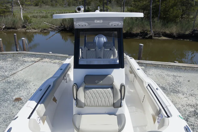 Slide: The Image of 2026 Key West 249 FS boat with sleek seating and modern design at a dock. - 17