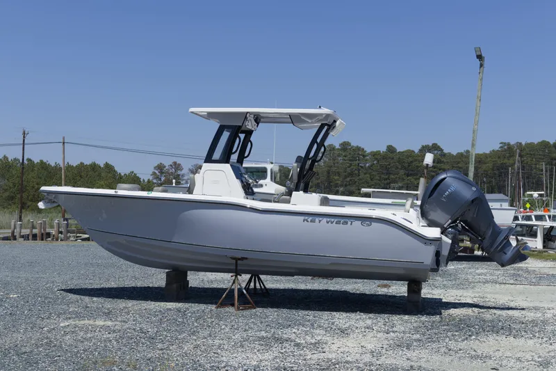 Slide: The Image of 2026 Key West 249 FS boat on display, featuring sleek design and powerful outboard motor. - 3
