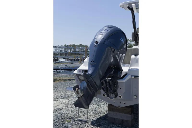 Slide: The Image of 2026 Key West 249 FS boat with Yamaha outboard motor, displayed on a gravel surface. - 6