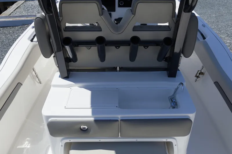 Slide: The Image of 2026 Key West 249 FS boat interior with rod holders and sink station. - 9
