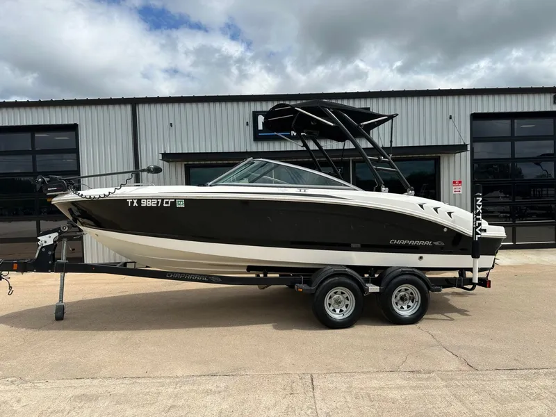 The Image of 2014 Chaparral 210 H20 Fish & Ski boat on trailer. - 1