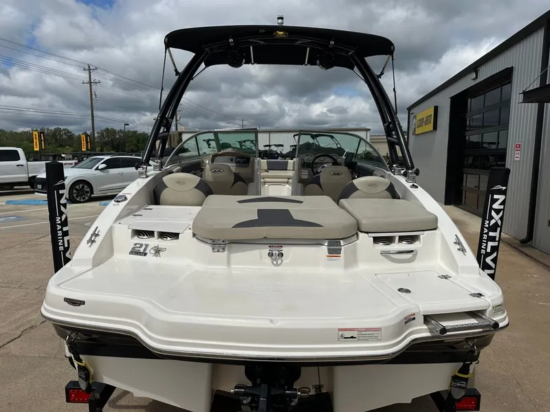 Slide: The Image of 2014 Chaparral 210 H20 Fish & Ski boat in parking lot. - 13