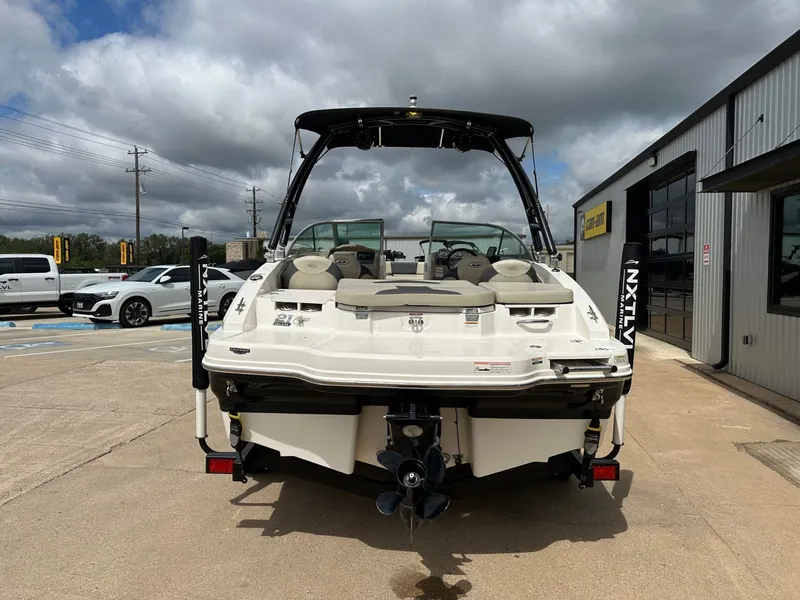 Slide: The Image of Rear view of 2014 Chaparral 210 H20 FISH & SKI boat in parking lot. - 4
