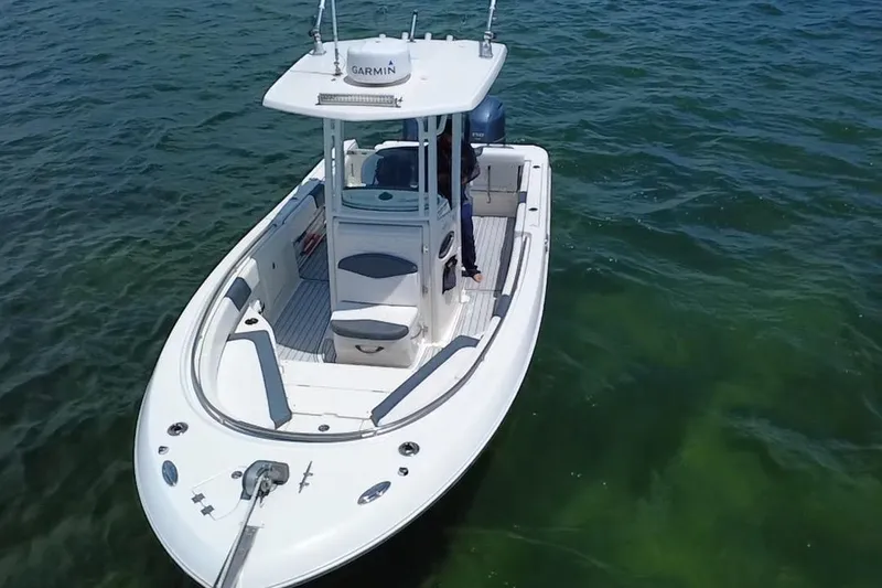 Slide: The Image of 2019 Robalo R242 Center Console boat on clear water, aerial view. - 25