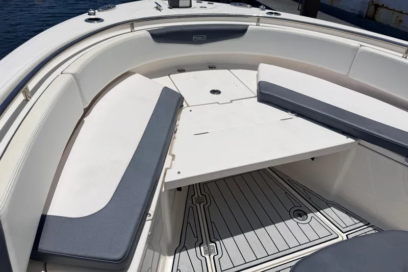 Slide: The Image of 2019 Robalo R242 Center Console boat interior with cushioned seating and deck. - 29