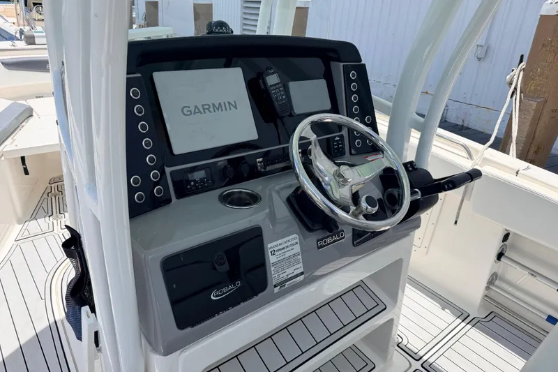 Slide: The Image of 2019 Robalo R242 Center Console boat dashboard with Garmin navigation system. - 30
