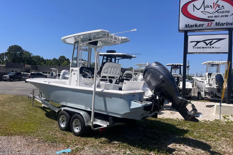 Slide: The Image of 2026 Tidewater 2210 Carolina Bay boat on trailer at Marker 17 Marine dealership. - 2