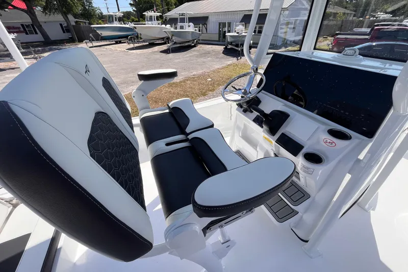 Slide: The Image of 2026 Tidewater 2210 Carolina Bay boat interior with sleek seating and modern console design. - 5
