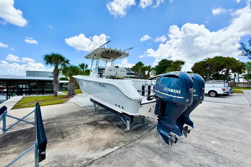 Slide: The Image of 2013 Edgewater 318CC boat with Yamaha engines on a sunny day. - 7