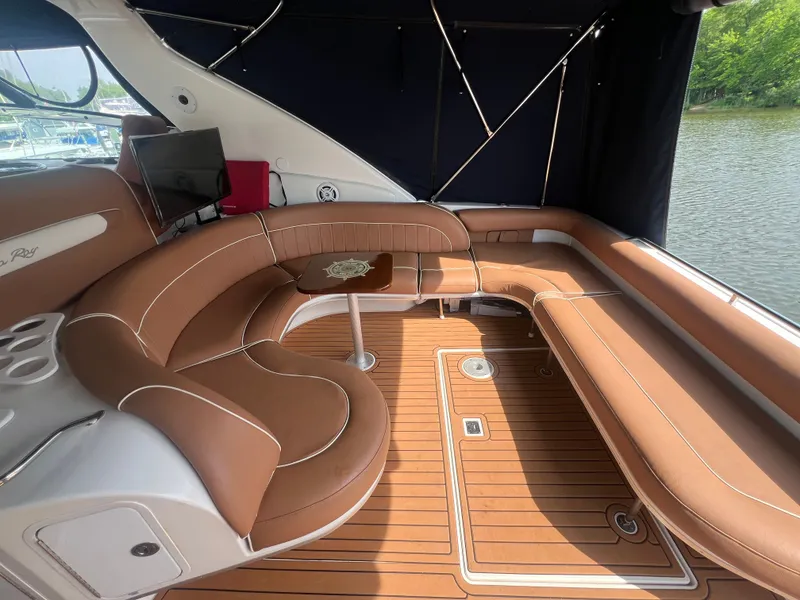 Slide: The Image of Interior of a 1997 Sea Ray 450 yacht with brown leather seating. - 12