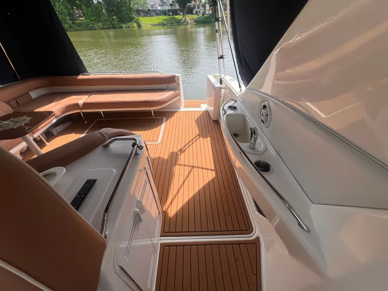 Slide: The Image of Interior of a 1997 Sea Ray 450 yacht with wooden flooring. - 16