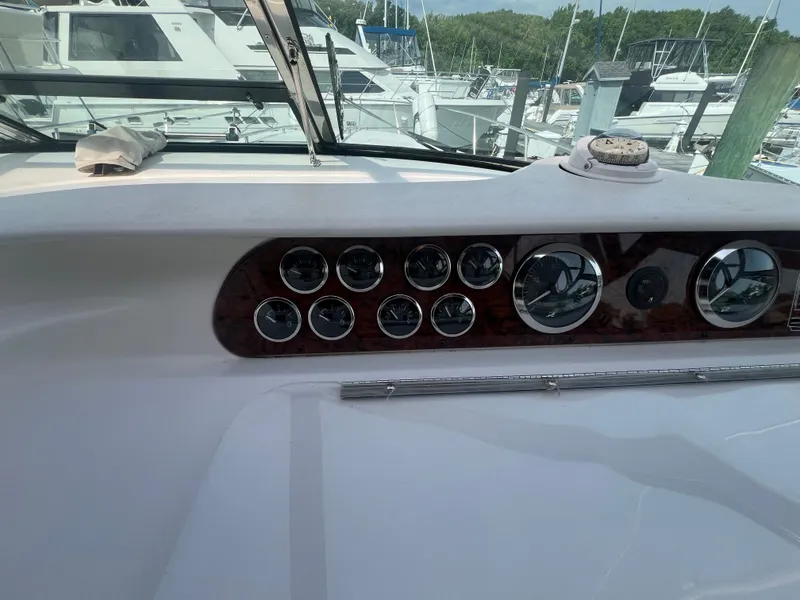 Slide: The Image of Dashboard of a 1997 Sea Ray 450 yacht in the marina. - 20