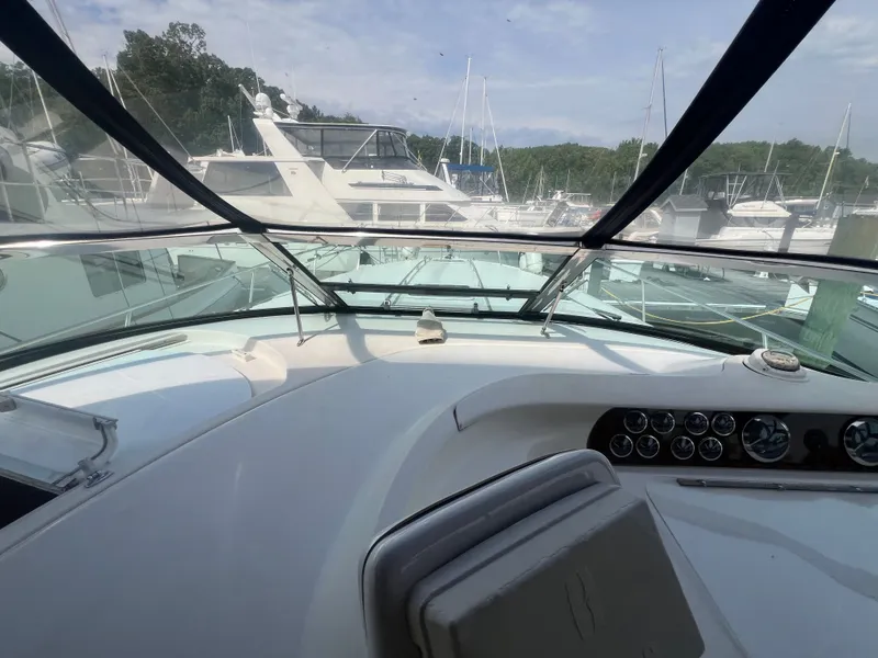 Slide: The Image of Interior view of a 1997 Sea Ray 450 yacht at the marina. - 23