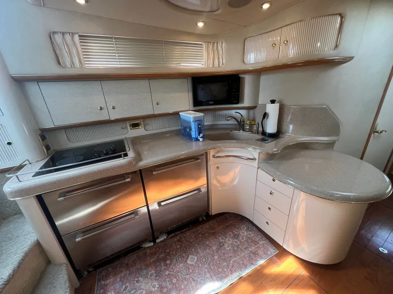 Slide: The Image of Interior of 1997 Sea Ray 450 yacht kitchen. - 27