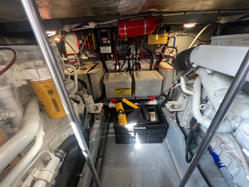 Slide: The Image of Engine room of a 1997 Sea Ray 450 with batteries and tools. - 3