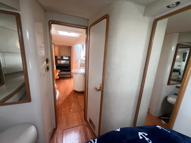 Slide: The Image of Interior of a 1997 Sea Ray 450 yacht with wooden flooring. - 37