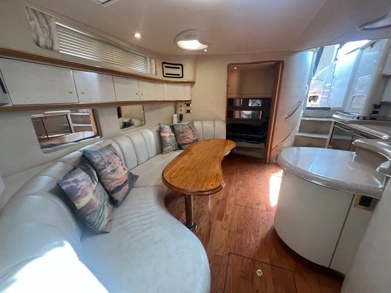 Slide: The Image of Interior of a 1997 Sea Ray 450 yacht with elegant furnishings. - 38