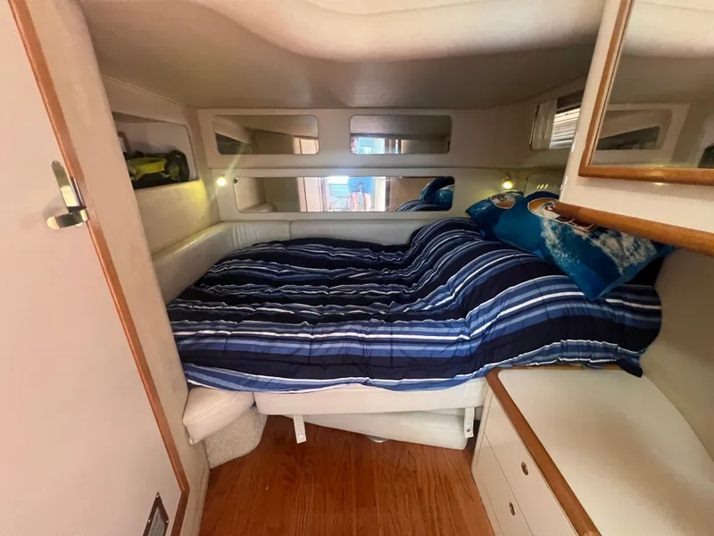 Slide: The Image of Interior of a 1997 Sea Ray 450 yacht with cozy bed. - 42