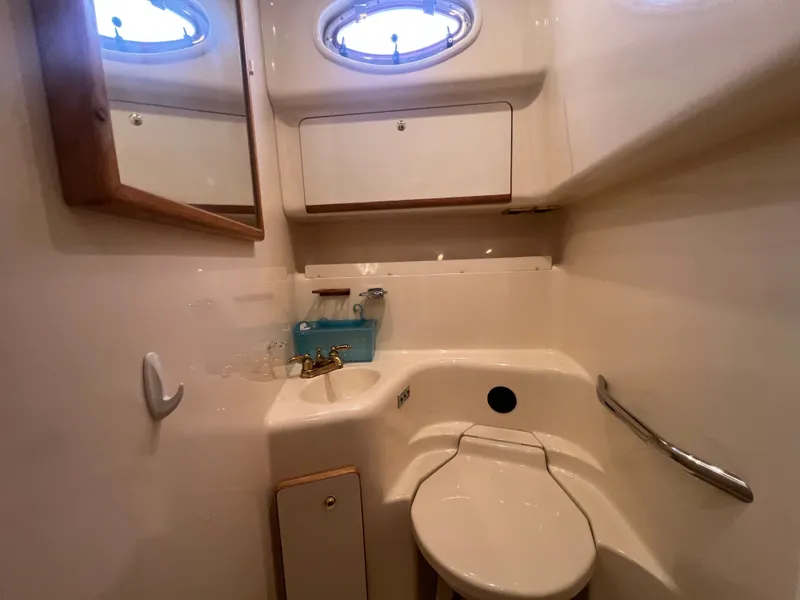 Slide: The Image of Interior view of 1997 Sea Ray 450 yacht bathroom. - 47