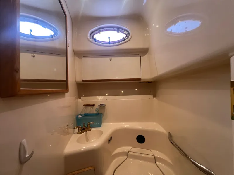 Slide: The Image of Interior of a 1997 Sea Ray 450 yacht, bathroom view. - 49