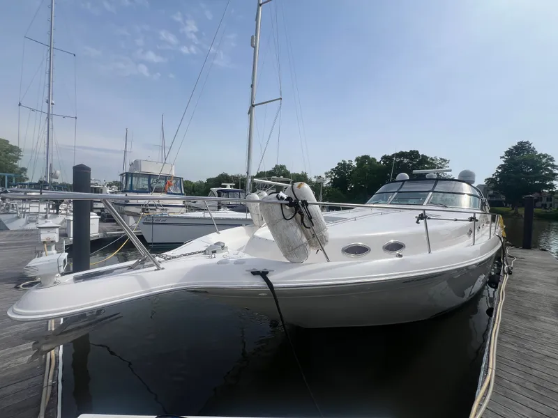 Slide: The Image of 1997 Sea Ray 450 yacht docked at marina. - 5